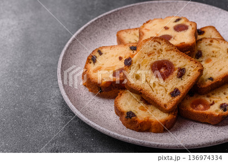 Fruit cake, a dessert with cherries, plums, and raisins for a festive Christmas table. Fruit cake 136974334