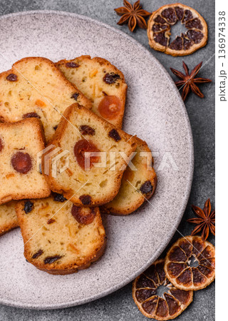 Fruit cake, a dessert with cherries, plums, and raisins for a festive Christmas table. Fruit cake 136974338