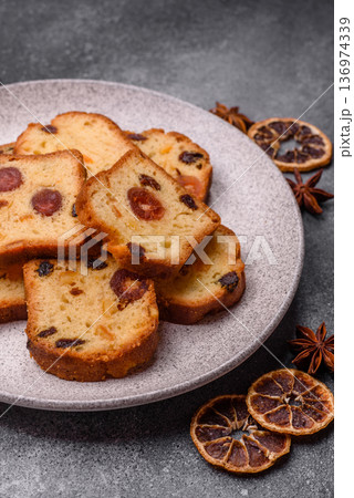 Fruit cake, a dessert with cherries, plums, and raisins for a festive Christmas table. Fruit cake 136974339