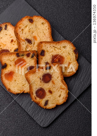 Fruit cake, a dessert with cherries, plums, and raisins for a festive Christmas table. Fruit cake 136974350