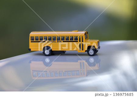 Toy american yellow school bus as symbol of education in the USA 136975685
