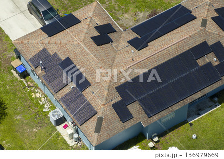 Autonomous home. Solar panels on house roof. Photovoltaic sells for producing clean ecological electric energy. Investing in renewable electricity for retirement income 136979669