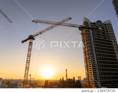 Miami, Florida. USA big city urban landscape at sunset. Developing American megapolis with new high-rise buildings under construction Miami, Florida. USA big city urban landscape at sunset. Developing American megapolis with new high-rise buildings under construction 136979719