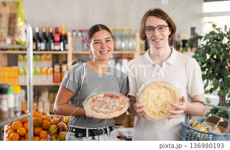 Couple choosing pizza Couple choosing pizza 136980193