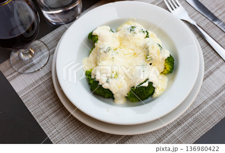 Broccoli and cauliflower gratin with cheese. 136980422