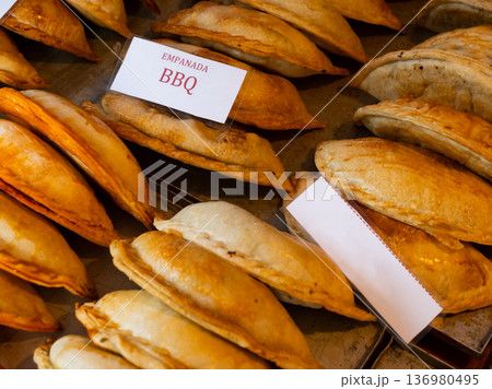Rows of fresh, just baked empanadas 136980495