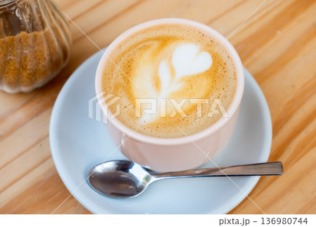 Cup of fresh cortado on table 136980744