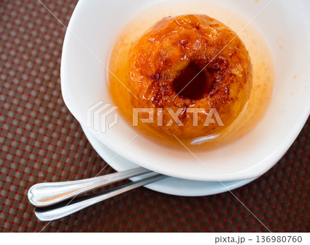 Baked apple served on platter for dessert Baked apple served on platter for dessert 136980760