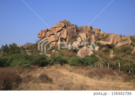 Granite hill and boulder in Basapur, Karnataka, India. 136982786