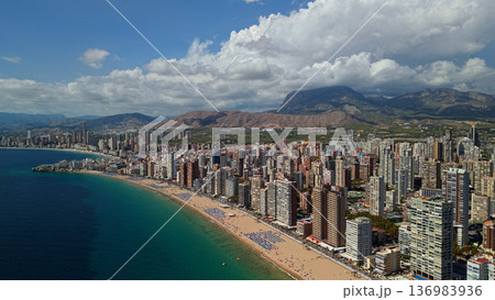 Aerial panoramic view of Benidorm coastline with high rise skyline and sandy Mediterranean beach Spain Aerial panoramic view of Benidorm coastline with high rise skyline and sandy Mediterranean beach Spain 136983936