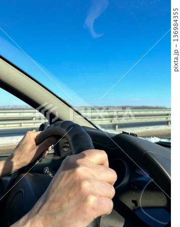 Hands on the wheel 136984355