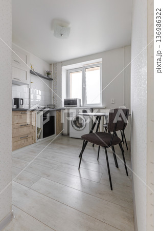 Modern Compact Kitchen with Dining Area and Laundry Modern Compact Kitchen with Dining Area and Laundry 136986322