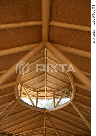 A thatched ceiling in a rustic house on Hainan Island in China 136986381
