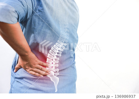 Mature Asian man suffering from back pain with red x-ray spine bone graphic overlay, male holding his lower back feeling ache from muscle strain, herniated disc or office syndrome. Mature Asian man suffering from back pain with red x-ray spine bone graphic overlay, male holding his lower back feeling ache from muscle strain, herniated disc or office syndrome. 136986937
