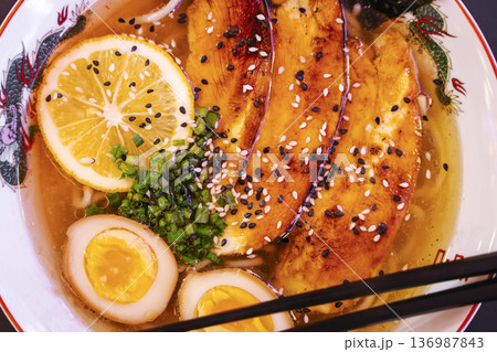 Asian Chicken Ramen Noodle Soup in a Bowl 136987843