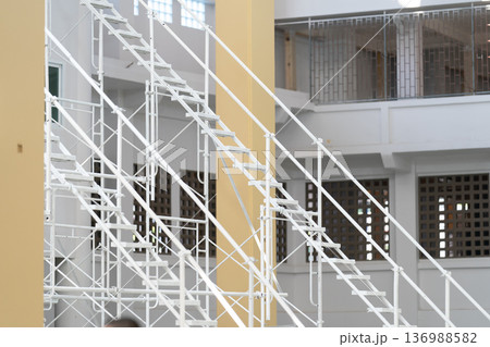 The steel used to construct the white scaffolding ladder is sturdy and long lasting. 136988582