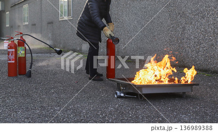 corporate safety - exercise during a firefighting course corporate safety - exercise during a firefighting course 136989388