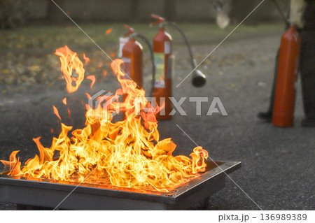 corporate safety - exercise during a firefighting course corporate safety - exercise during a firefighting course 136989389