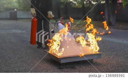corporate safety - exercise during a firefighting course corporate safety - exercise during a firefighting course 136989391