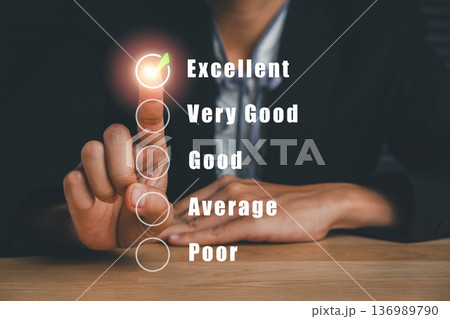 Businessman interacting with a virtual feedback form, highlighting excellent rating with a glowing checkmark. 136989790