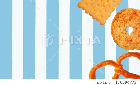 Colorful snacks on a blue and white striped background for Easter celebration enjoyment 136990773