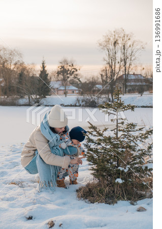 Mother and Baby in Winter Wonderland Mother and Baby in Winter Wonderland 136991686