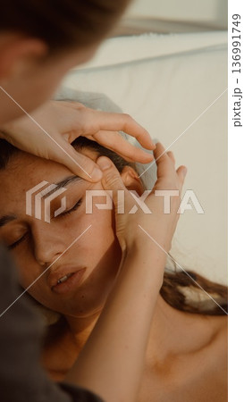Facial massage performed to relax muscles and improve skin health 136991749
