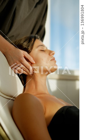 Therapy for neck. Patient undergoes targeted neck and chest treatment Therapy for neck. Patient undergoes targeted neck and chest treatment 136991804
