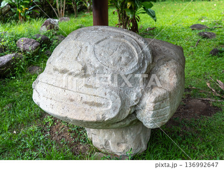 Stone sculpture of a birthing woman at Te Lipona, Hiva Oa, French Polynesia 136992647