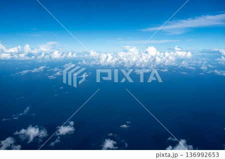 Aerial view of fluffy clouds over the Pacific Ocean in Polynesia 136992653