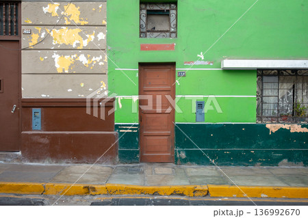 Green wall with windows and door in Lima, Peru 136992670
