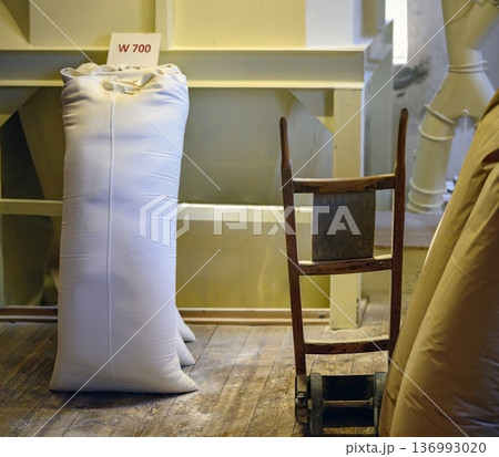 Sack with wheat flour and a sack barrow Sack with wheat flour and a sack barrow 136993020