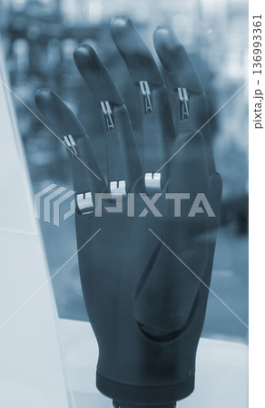 Bionic arm prosthesis. Plastic prosthesis printed on a 3D printer. Robotic arm. Robotics prosthesis for hand printed on a 3D printer from plastic powder. Modern new innovation medicine technologies. 136993361