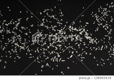Grated coconut powder. Dry coco flakes pile, shredded desiccated coconut, tropical fruit chips Grated coconut powder. Dry coco flakes pile, shredded desiccated coconut, tropical fruit chips 136993819