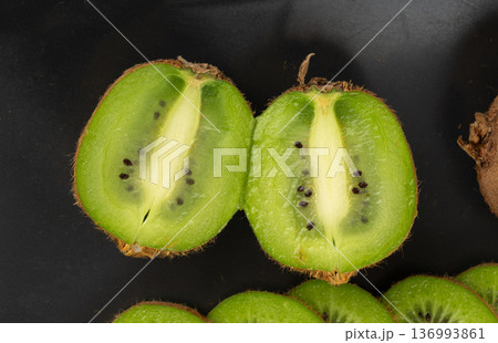 Kiwi fruit pattern, green kiwifruit slice texture Kiwi fruit pattern, green kiwifruit slice texture 136993861