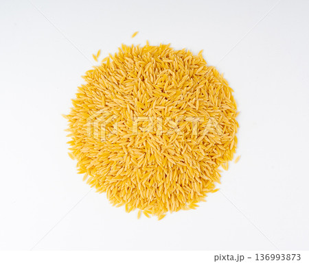 Raw orzo pasta, risoni or kritharaki pile 136993873