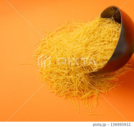 Raw vermicelli, gold soup pasta, small homemade noodles, thin Italy macaroni Raw vermicelli, gold soup pasta, small homemade noodles, thin Italy macaroni 136993912
