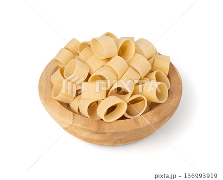 Raw Calamarata Big Pasta Isolated, Homemade Dry Macaroni, Italian Raw Round Noodle 136993919