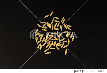 Raw orzo pasta, risoni or kritharaki pile 136993973