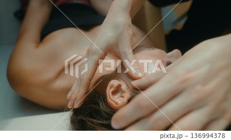 Soothing spa session focusing on lymphatic drainage around face and neck 136994378