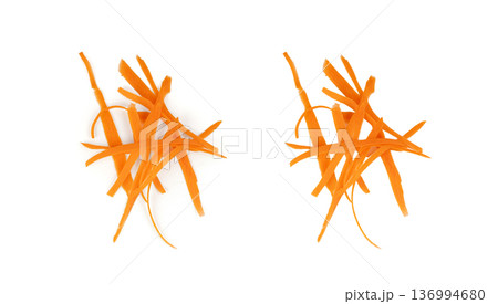 Thin carrot strips isolated. Carrot slices for vegetable salad Thin carrot strips isolated. Carrot slices for vegetable salad 136994680
