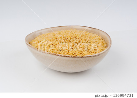 Raw orzo pasta, risoni or kritharaki pile 136994731