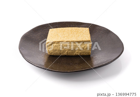 Tofu Cheese Isolated, Smoked Vegan Cheese Slice, Sliced Soya Bean Curd, Soy Protein or TSP Tofu Cheese Isolated, Smoked Vegan Cheese Slice, Sliced Soya Bean Curd, Soy Protein or TSP 136994775