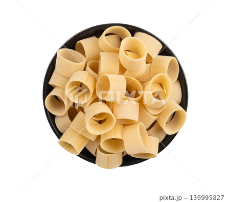 Raw Calamarata Big Pasta Isolated, Homemade Dry Macaroni, Italian Raw Round Noodle 136995827