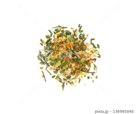 Dried vegetable mix isolated. Dehydrated greens, onion, carrot pieces, seasoning chips, flakes 136995848