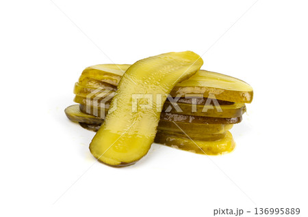 Pickled sliced cucumbers, fermented food, marinated canned vegetables, gherkins, pickles 136995889