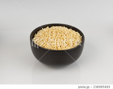 Puffed millet isolated, crispy cereal breakfast, ancient healthy food Puffed millet isolated, crispy cereal breakfast, ancient healthy food 136995893