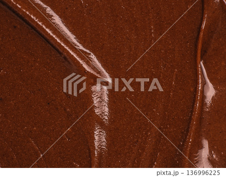 Chocolate spread texture with organic flowing lines background Chocolate spread texture with organic flowing lines background 136996225