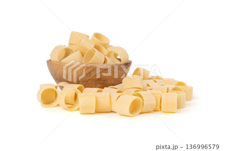 Raw Calamarata Big Pasta Isolated, Homemade Dry Macaroni, Italian Raw Round Noodle Raw Calamarata Big Pasta Isolated, Homemade Dry Macaroni, Italian Raw Round Noodle 136996579