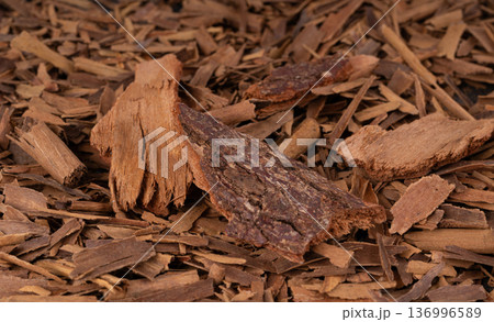 Broken ceylon cinnamon macro texture, cinnamomum verum bark pieces pattern 136996589